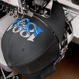 Manchester 1894 Worker Bee Heritage embroidered football trucker cap, dark heather gray colour, front view