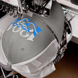 Manchester 1894 Worker Bee Heritage embroidered football trucker cap, heather grey white colour, front view