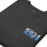 Close-up of Manchester 1894 Worker Bee embroidery on charcoal heather sweatshirt