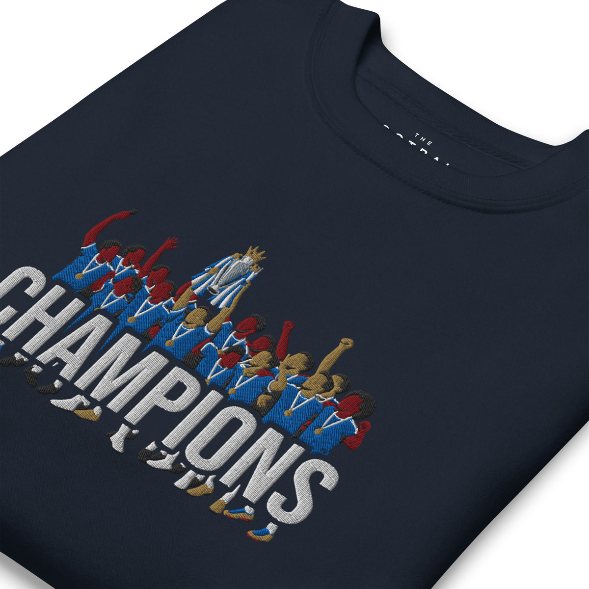 Folded angled view of Chelsea-inspired navy blazer sweatshirt with trophy-lift embroidery and CHAMPIONS lettering